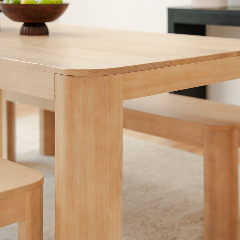 Contemporary wooden dining table with a smooth finish in modern kitchen setting.