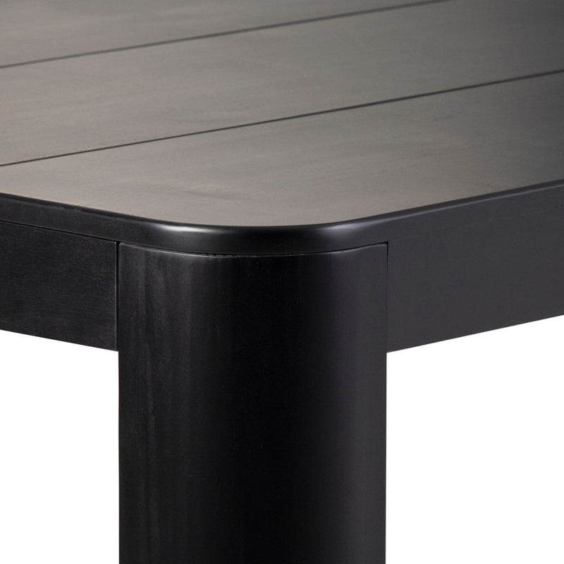 Modern black minimalist table corner with sleek design.
