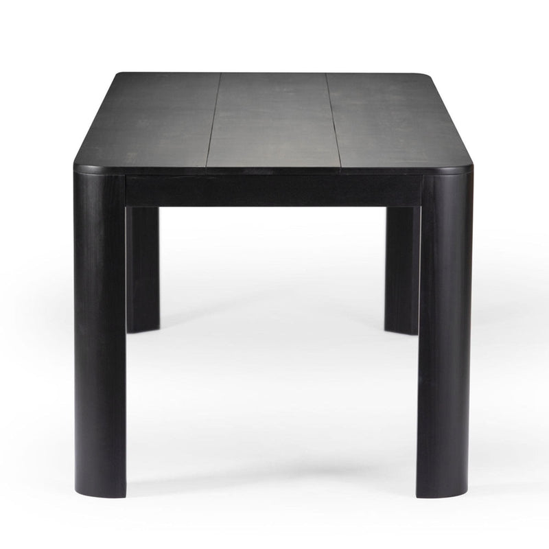 Black wooden dining table with rounded edges and minimalist design.