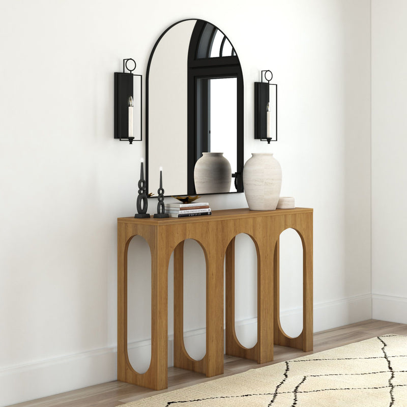Modern wooden console table with arched mirror and decorative vases in stylish living room.