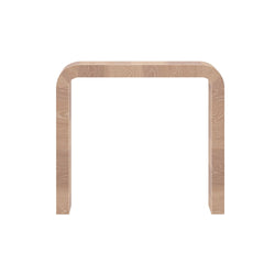 Modern minimalist wooden console table with curved design and natural finish.