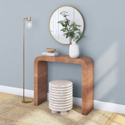 Modern entryway design with wooden console table, round mirror, and decorative floor lamp.
