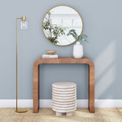 Modern minimalist interior design with wooden console table, decorative mirror, and stylish floor lamp.