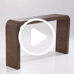 Modern curved solid walnut console table with rounded edges and U-shaped legs, minimalist wooden hallway or entryway table on white background