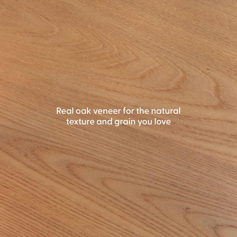 Close-up of natural oak veneer wood panel showing warm brown tones and distinct grain texture, ideal for furniture and flooring
