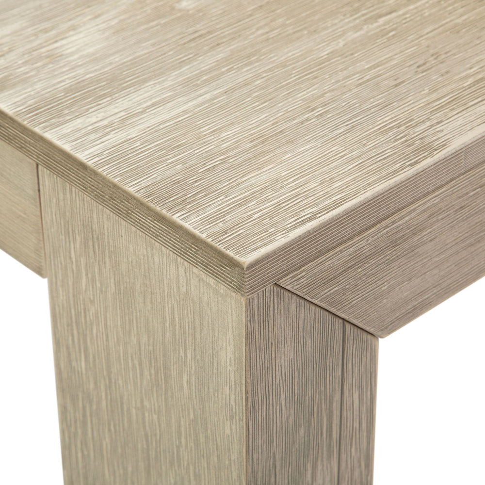 Close-up of textured wood table corner with modern design.