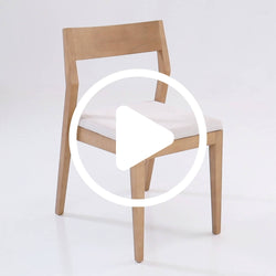 Modern Scandinavian light-wood dining chair with beige upholstered seat and angled backrest on white background, minimalist wooden frame for dining room or kitchen