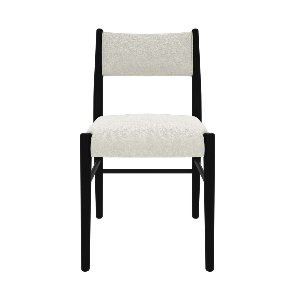 Modern black and white dining chair with plush upholstery.