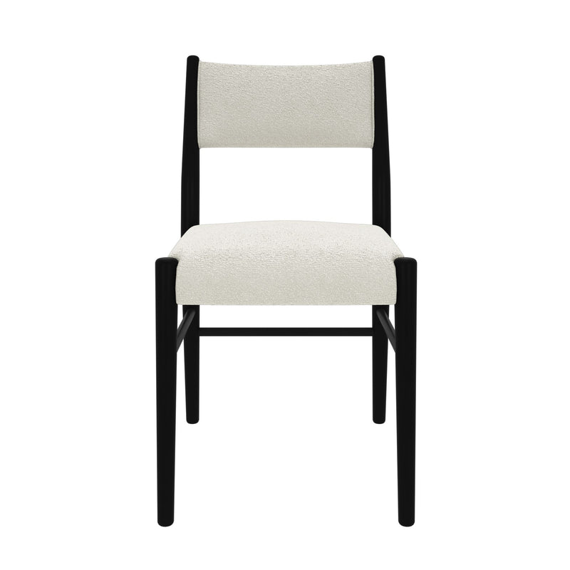 Modern black and white dining chair with plush upholstery.