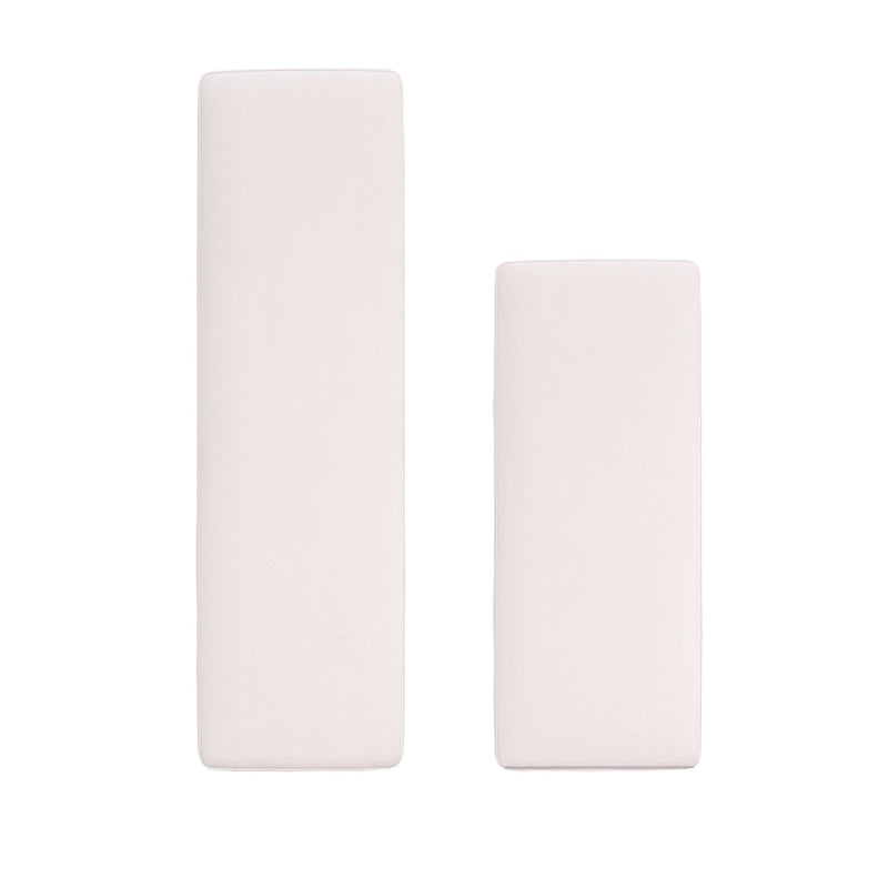 Two off-white rectangular seat cushions on white background — one tall narrow and one shorter wide, modern minimalist bench or sofa cushions