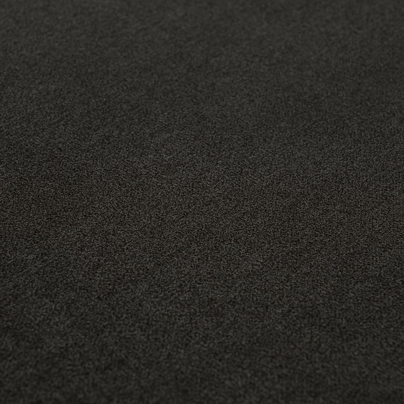 Dark charcoal carpet texture close-up, low-pile plush flooring background for interior design and home decor