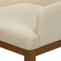 Beige upholstered bench seat corner with rounded armrest and walnut wood legs, modern mid-century dining bench design
