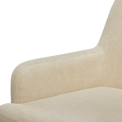 Beige velvet upholstered sofa armrest and seat cushion close-up, modern minimalist sectional with soft fabric texture