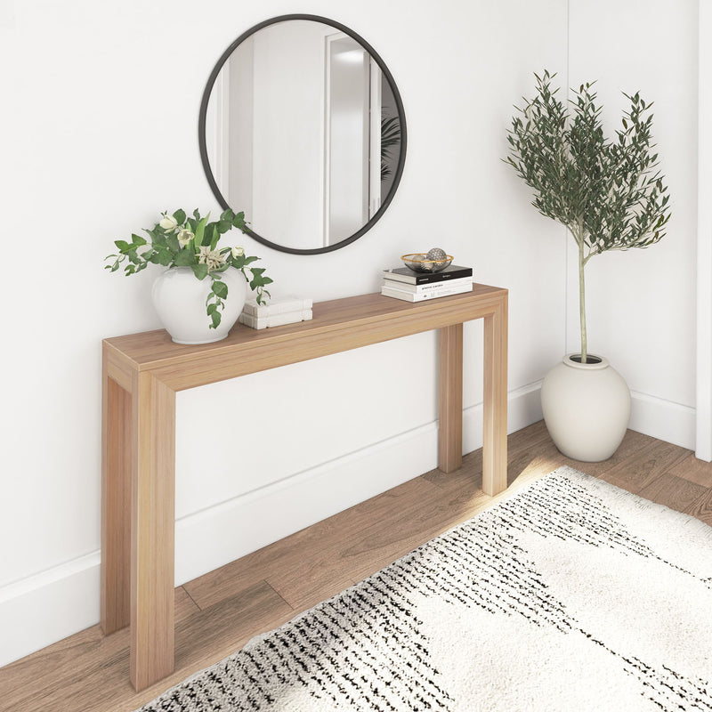 Minimalist entryway with a wooden console table, round mirror, and indoor plants for modern home decor.