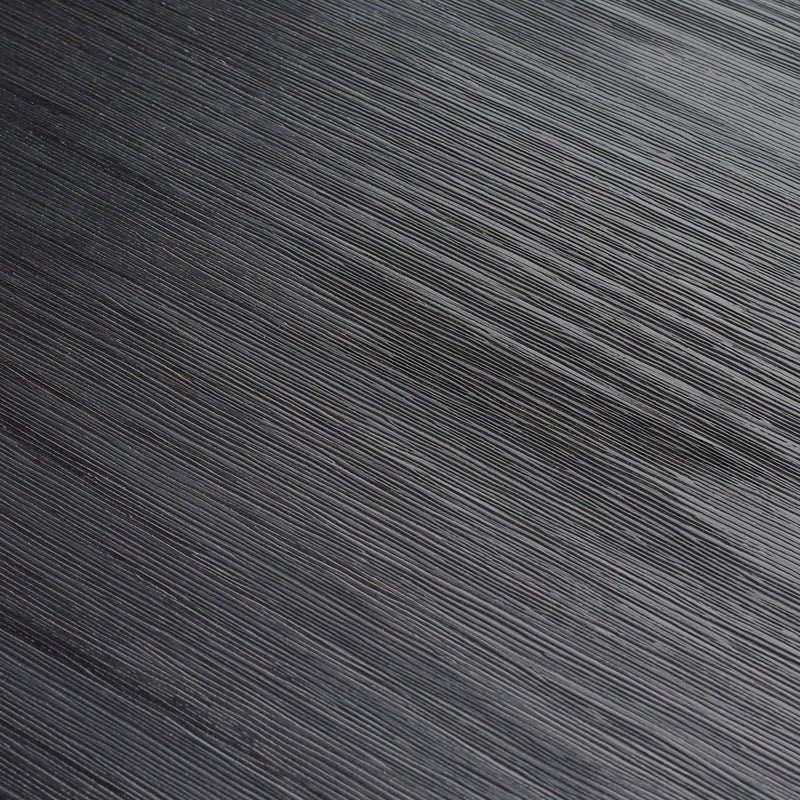 Black textured surface with linear patterns for abstract background design.