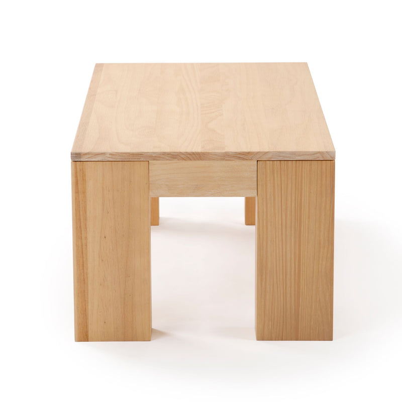Minimalist natural wood coffee table with sturdy legs and a smooth finish.