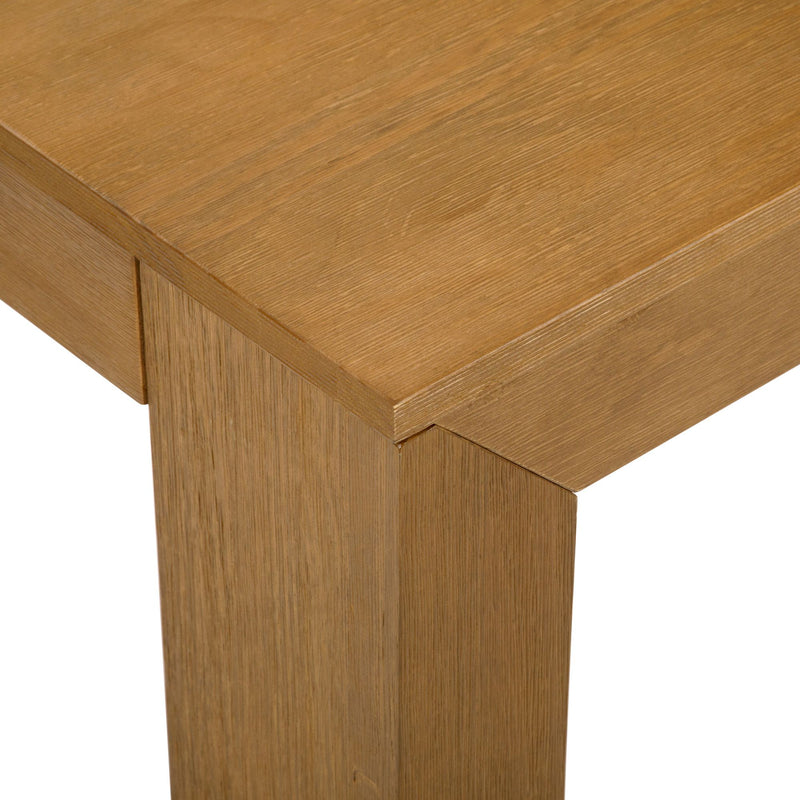 Close-up view of a modern wooden table corner with smooth grain texture.