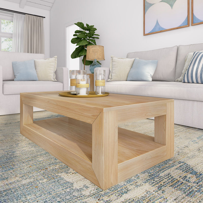 Modern living room with beige sofa, wooden coffee table, and cozy decor accents.