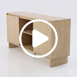 Light oak media console with sliding doors and open center shelf, low-profile wooden TV stand for living room storage