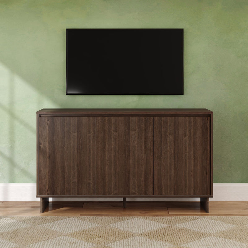 Wall-mounted flat-screen TV above a dark wood media cabinet in a minimalist living room with a green textured wall and hardwood floor