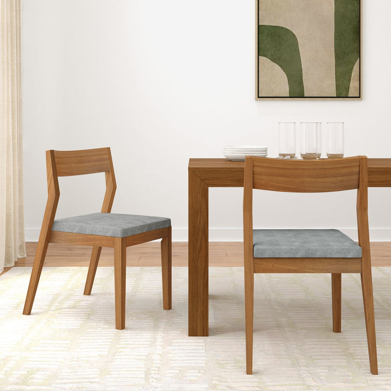 Modern wooden dining set with gray upholstered chairs in a stylish minimalist dining room.
