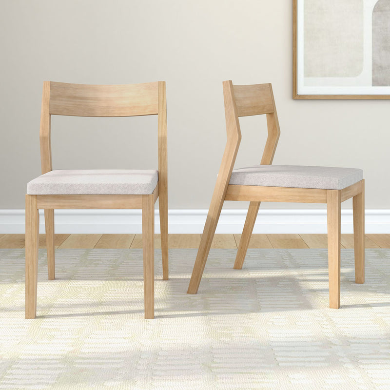 Modern wooden chairs with beige cushions in a minimalist living room setting.