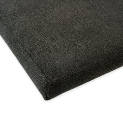 Close-up of a black acoustic panel corner for soundproofing and noise reduction.