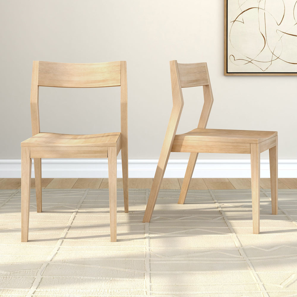 Two modern wooden chairs on a light patterned rug in a minimalist room setting.