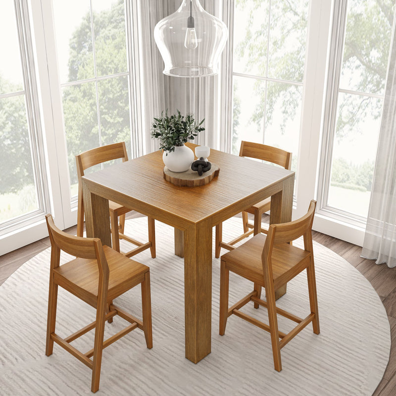 Modern dining room with wooden table, four chairs, and decorative plant centerpiece in a bright, natural light setting.
