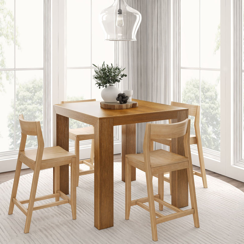 Modern dining room with wooden table and chairs, featuring decorative centerpiece and pendant light.