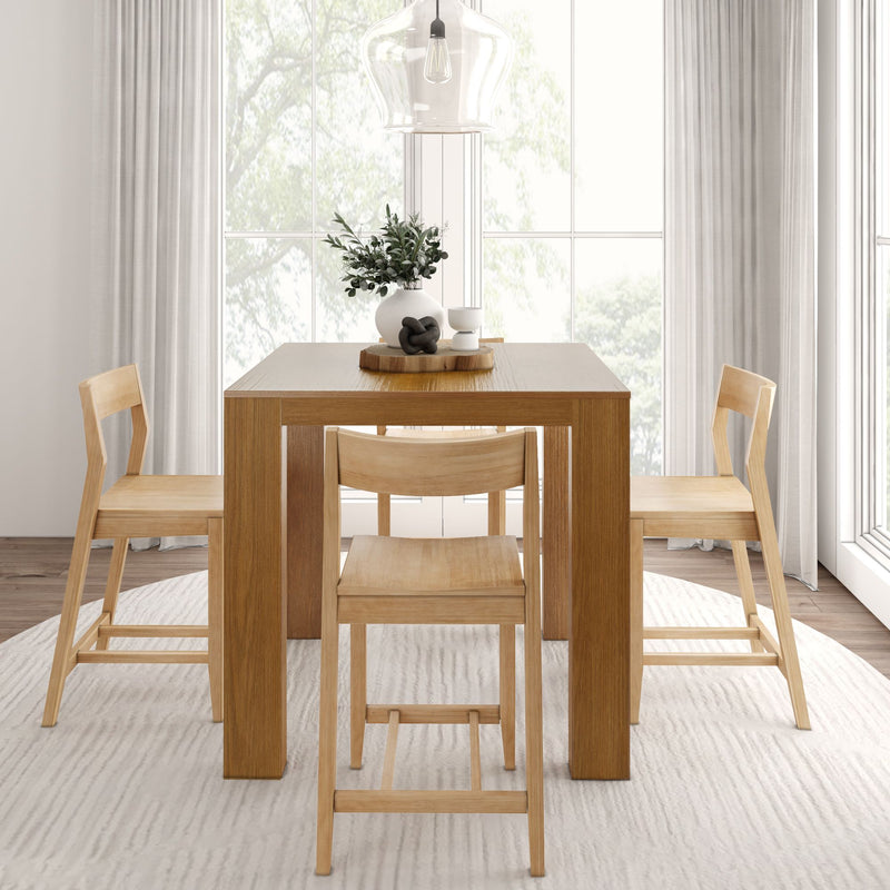 Modern minimalist dining room with wooden table and chairs, featuring a stylish pendant light and natural decor.