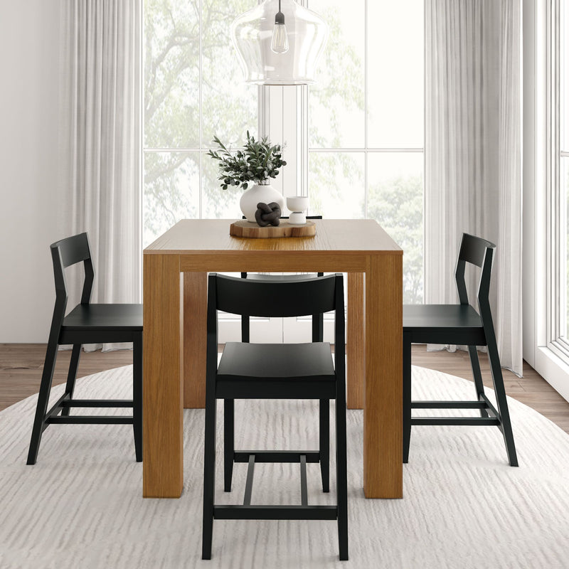 Modern dining room with wooden table and black chairs, minimalist interior design with natural light.