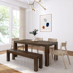 Modern dining room with a dark wood table, bench seating, neutral chairs, abstract art, and geometric chandelier.