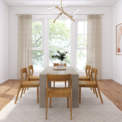 Modern dining room with wooden table and chairs, large windows, and contemporary lighting fixture.