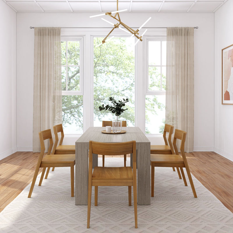 Modern dining room with wooden table and chairs, large windows, and contemporary lighting fixture.