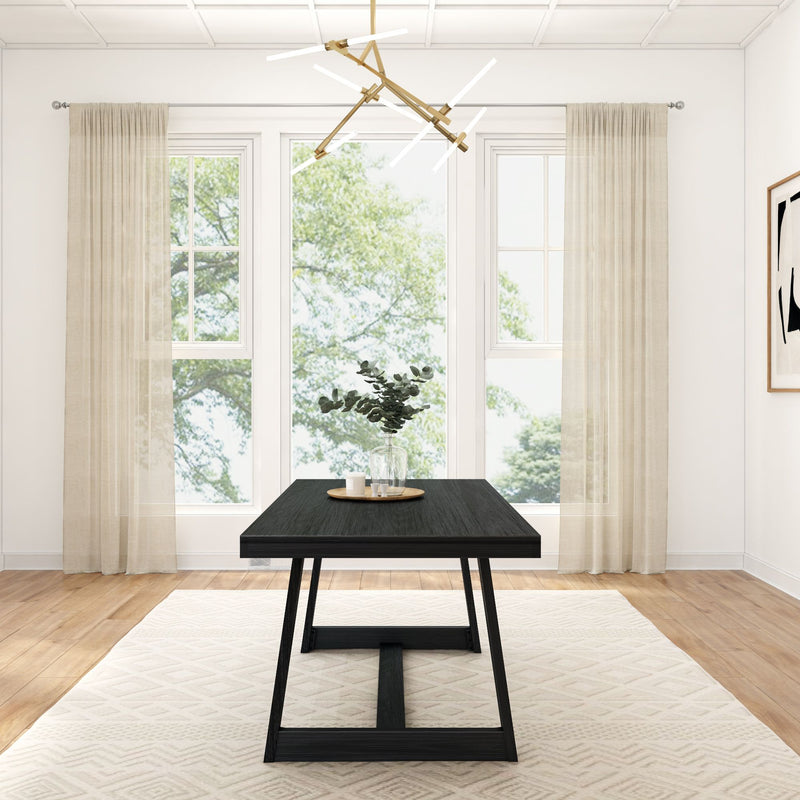Modern dining room with large windows, minimalist black table, geometric chandelier, and beige curtains.