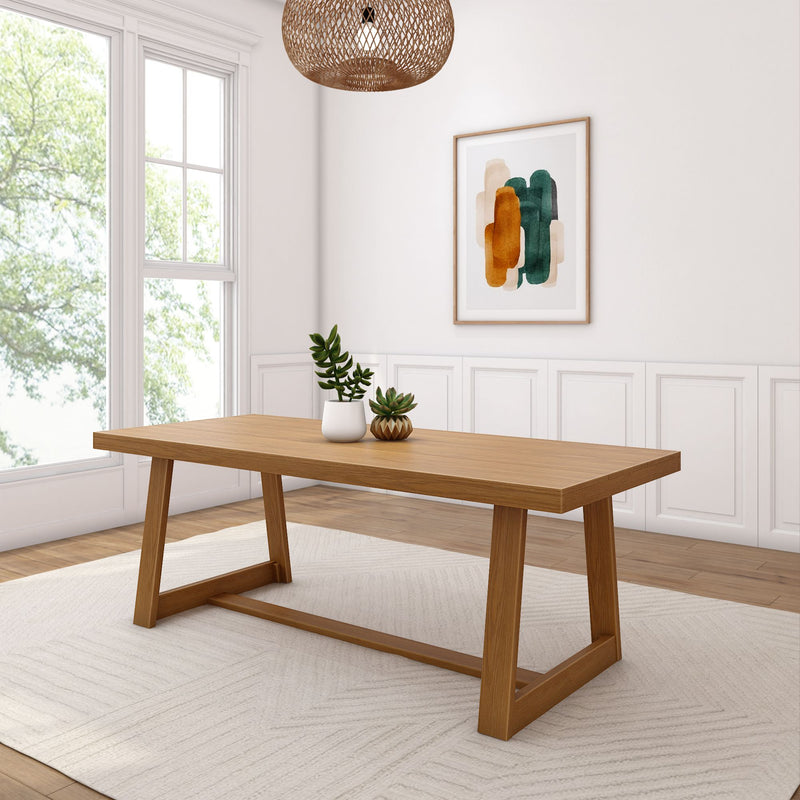 Modern dining room interior with wooden table, minimalist decor, and abstract wall art.