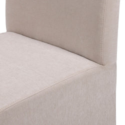 Close-up of beige upholstered dining chair showing linen-like fabric texture and stitching detail on a modern armless seat and back