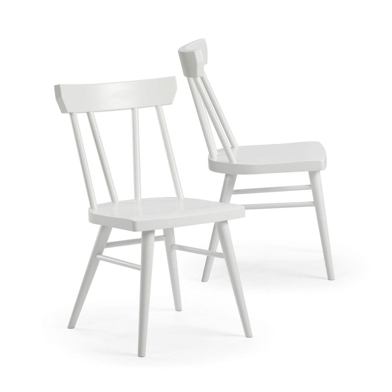 White wooden farmhouse-style chairs with spindle backs, ideal for rustic dining room decor.