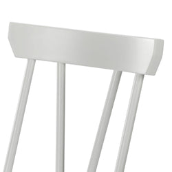 Close-up of white painted wooden spindle-back dining chair with minimalist modern design on white background