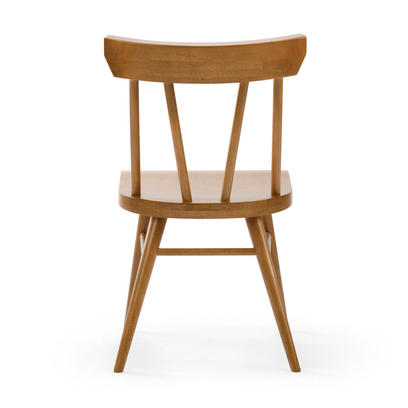 Mid-century modern Scandinavian wooden dining chair with curved spindle back, tapered oak legs and natural finish on white background