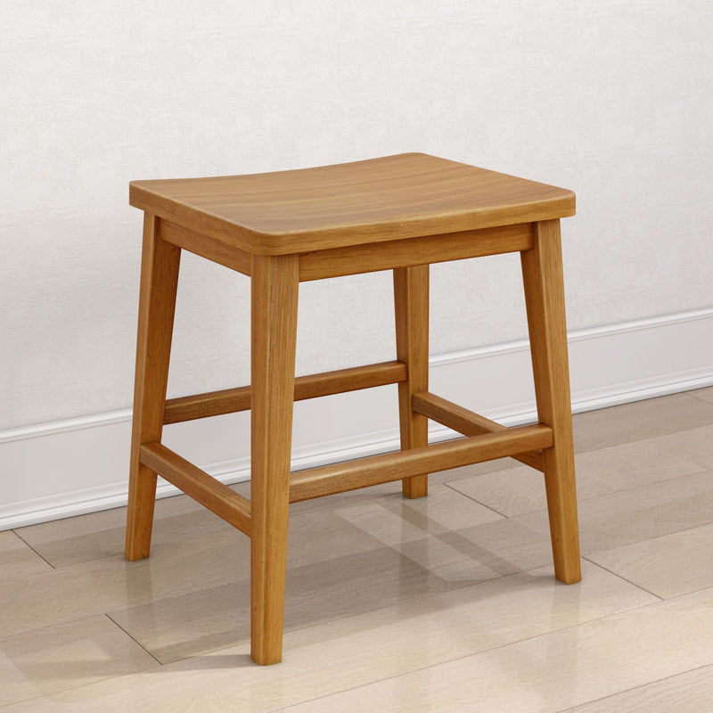 Wooden stool with curved seat on hardwood floor against white wall.