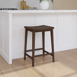 Wooden bar stool next to a modern white kitchen island with marble countertop.