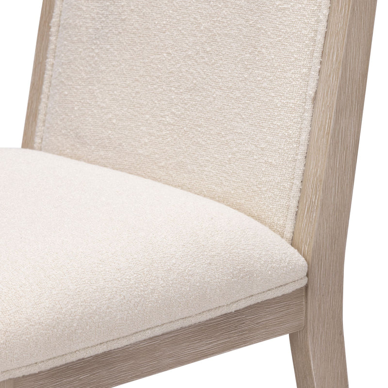 Beige upholstered wooden chair with textured fabric and light wood frame.