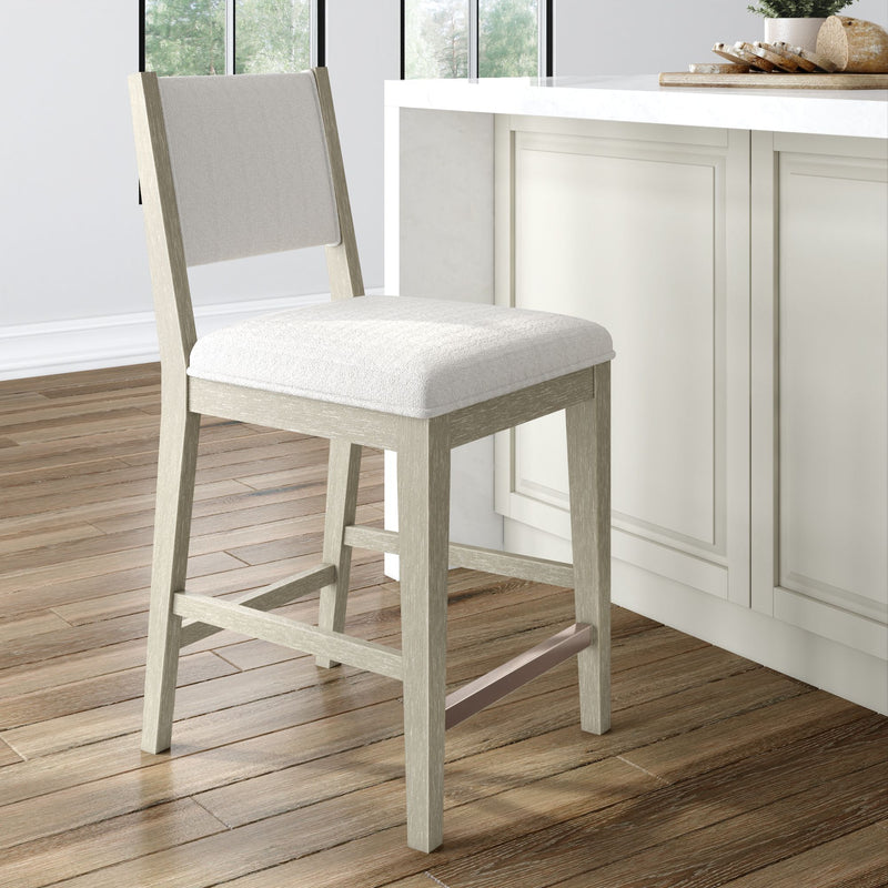 Bar stool with cushioned seat in a modern kitchen setting.