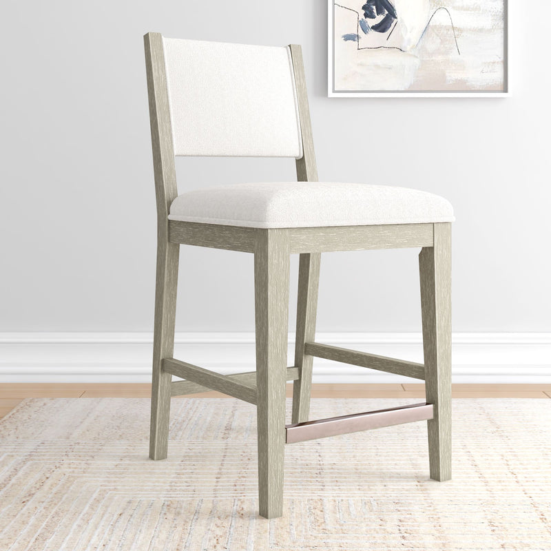 Modern gray wooden bar stool with white cushioned seat in stylish living room.