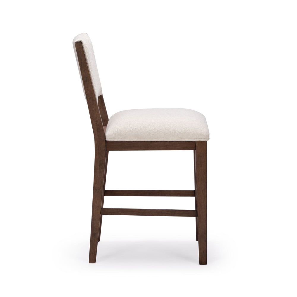Side view of a modern wooden chair with cream upholstery, ideal for dining room or kitchen decor.