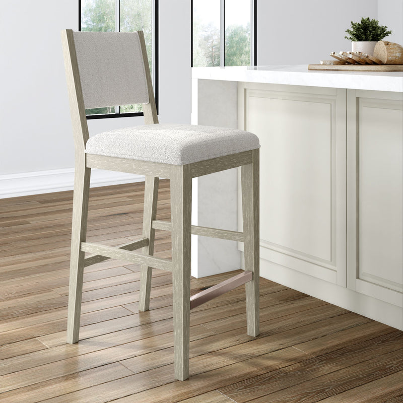 Modern wooden bar stool with cushioned seat in a bright kitchen setting.