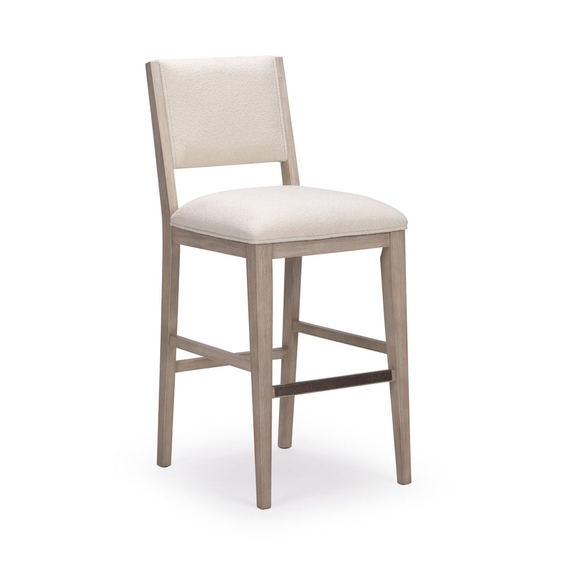 Tall wooden bar stool with white cushioned seat and back.