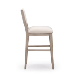 Side view of modern wooden bar stool with cream upholstery, ideal for kitchen islands and dining areas.